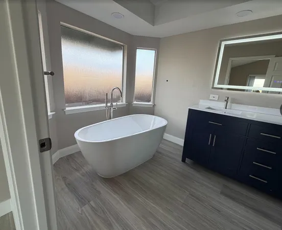a room with a sink and a mirror