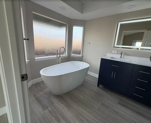 a room with a sink and a mirror