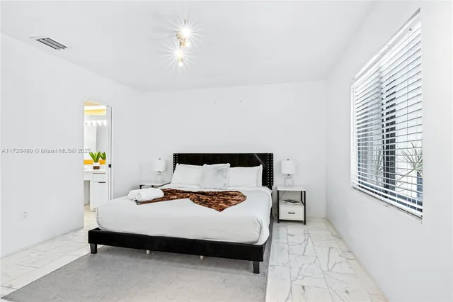 a view of swimming pool with lawn chairs and couches