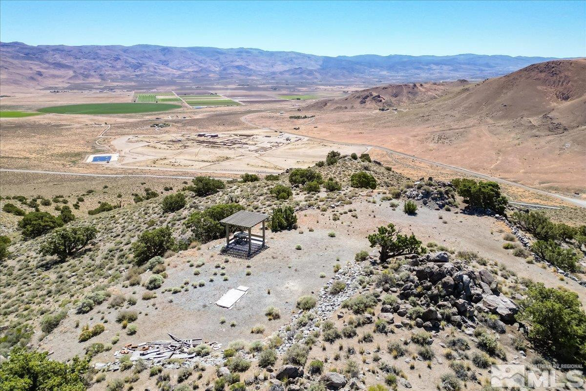 0 Pyramid Way, Unit LEFT TURN OFF OF PYRAMID HIGHWAY SIGN ON ROAD Reno, NV 89510 - Photo 16 of 26 a view of a mountain with an ocean beach