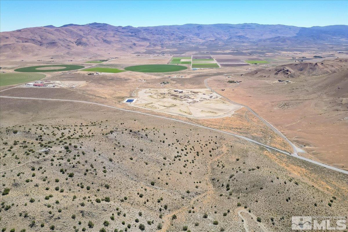 0 Pyramid Way, Unit LEFT TURN OFF OF PYRAMID HIGHWAY SIGN ON ROAD Reno, NV 89510 - Photo 20 of 26 a view of a yard with an ocean beach