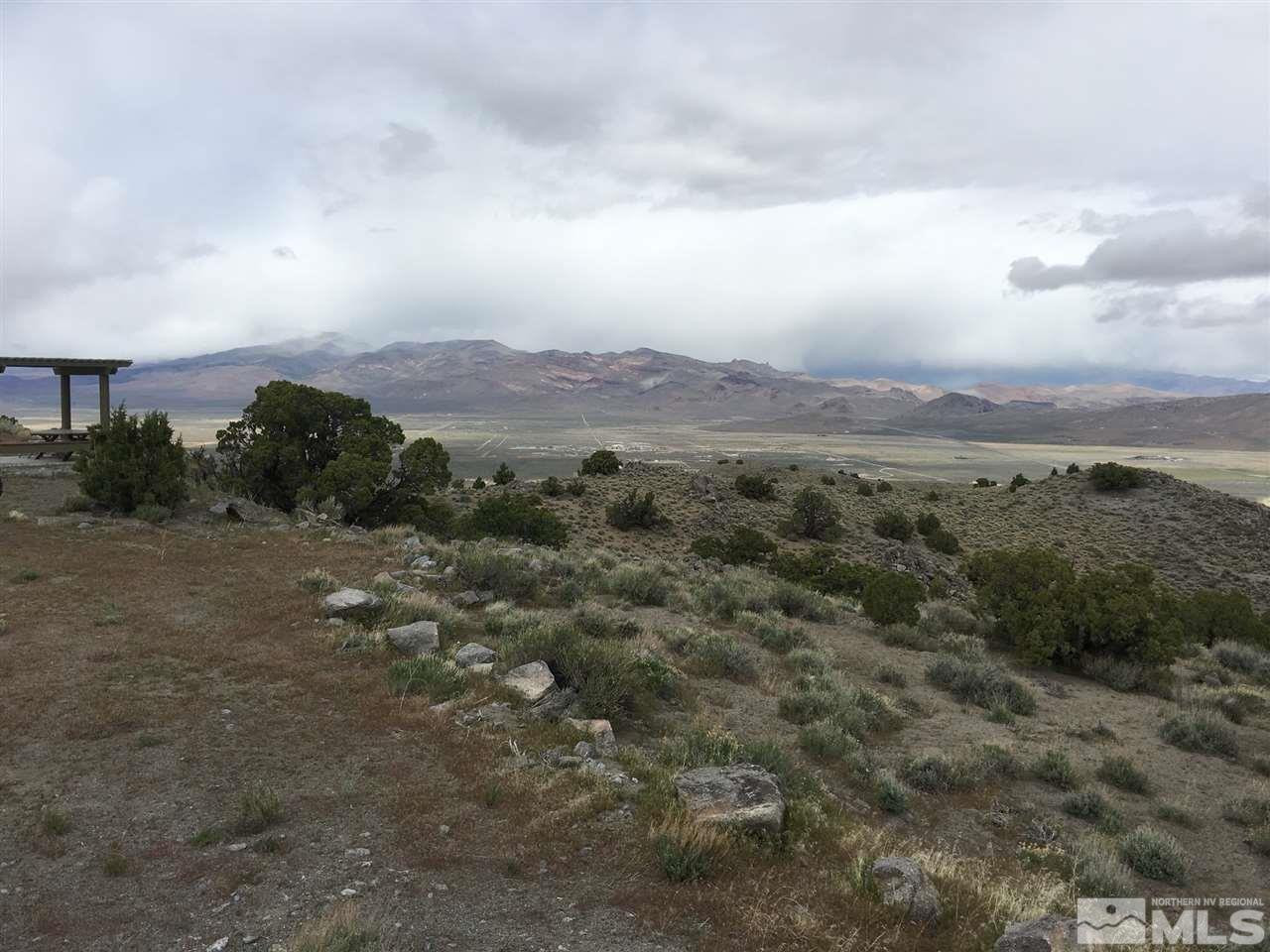 0 Pyramid Way, Unit LEFT TURN OFF OF PYRAMID HIGHWAY SIGN ON ROAD Reno, NV 89510 - Photo 2 of 26 an aerial view of houses covered in trees