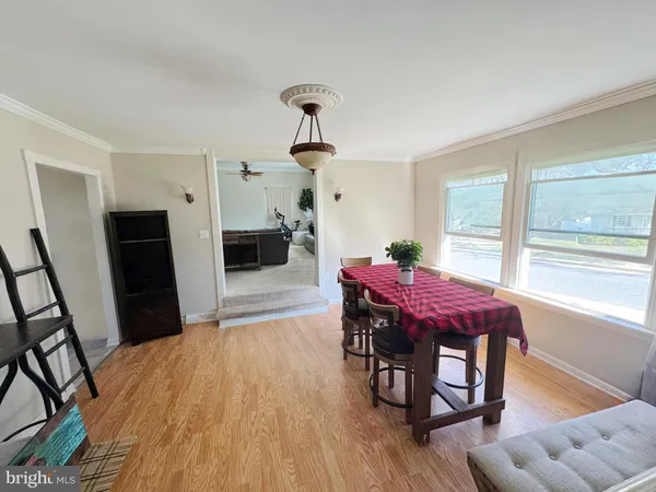 a dining room with furniture and window