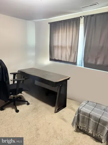 a room with a bed and a window