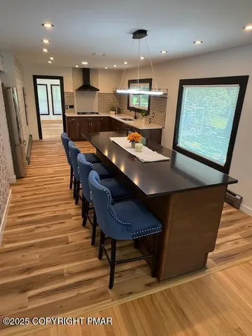 a dining room with furniture and a rug