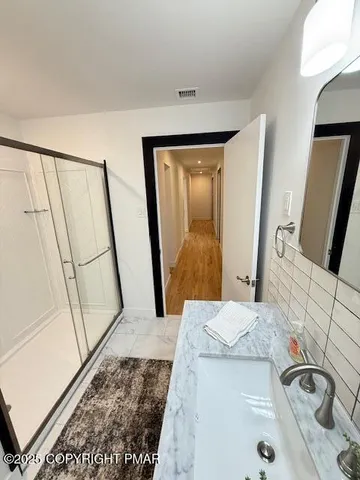 a bathroom with a sink and a mirror