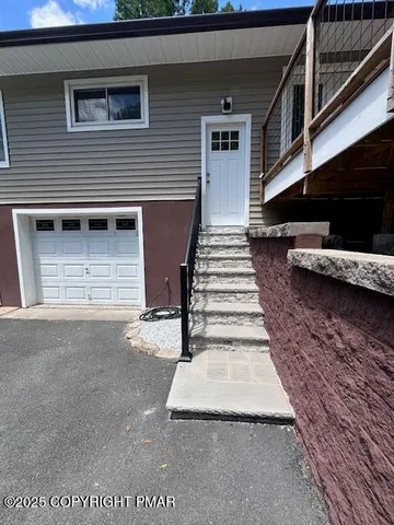 a view of entryway with a front door