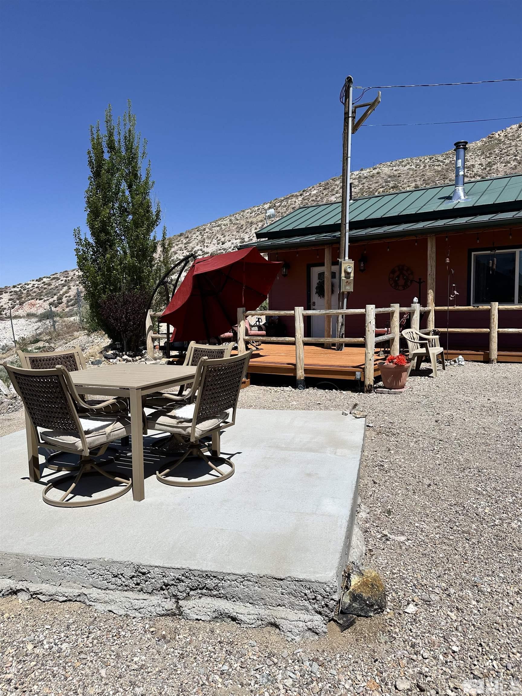 580 Silver Circle Tonopah, NV 89049 - Photo 1 of 37 a view of a terrace with a sitting space