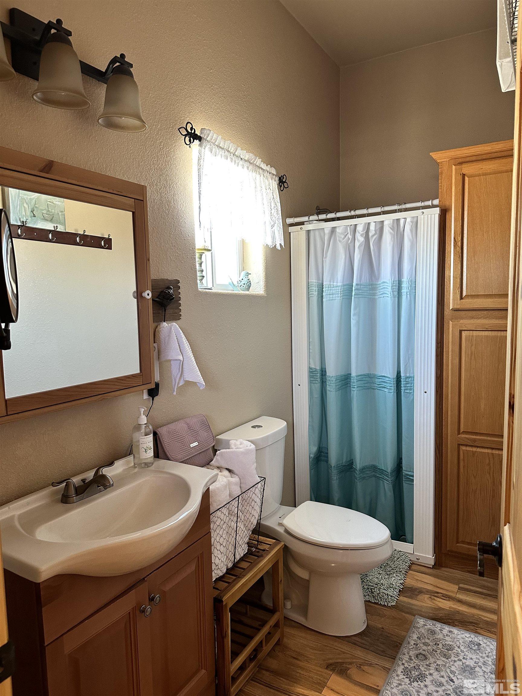 580 Silver Circle Tonopah, NV 89049 - Photo 12 of 37 a bathroom with a sink toilet and shower
