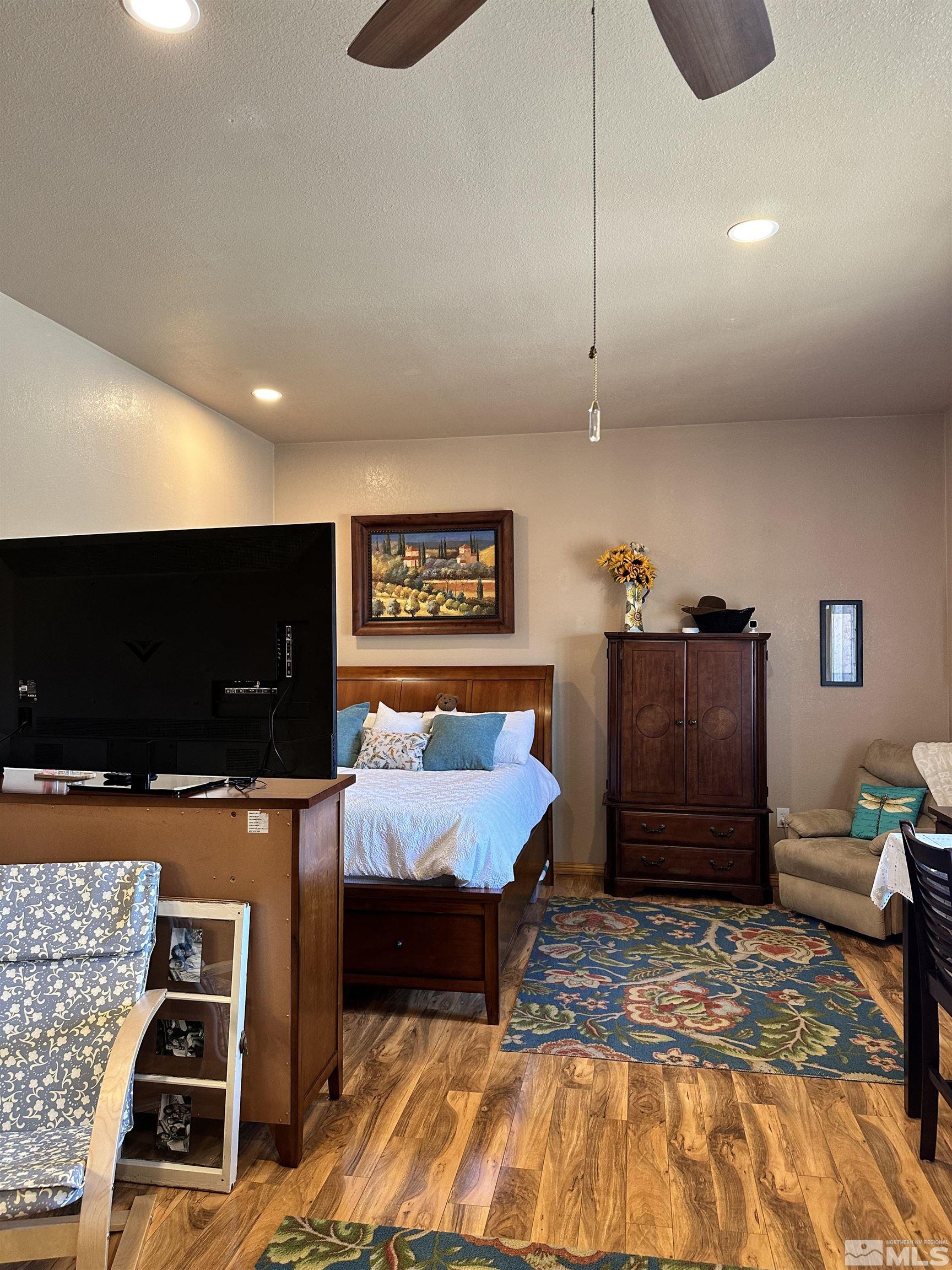 580 Silver Circle Tonopah, NV 89049 - Photo 17 of 37 a living room with furniture and a flat screen tv