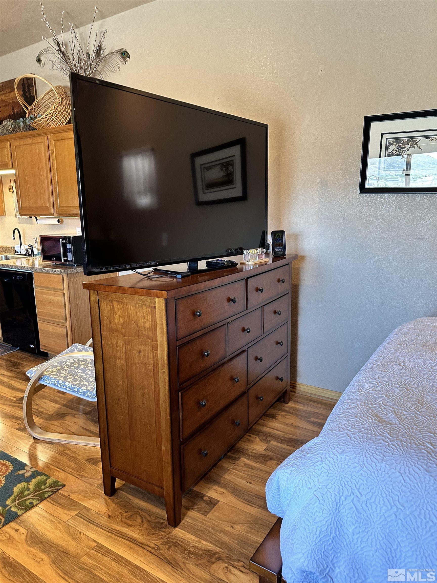 580 Silver Circle Tonopah, NV 89049 - Photo 18 of 37 a room with furniture and flat screen tv