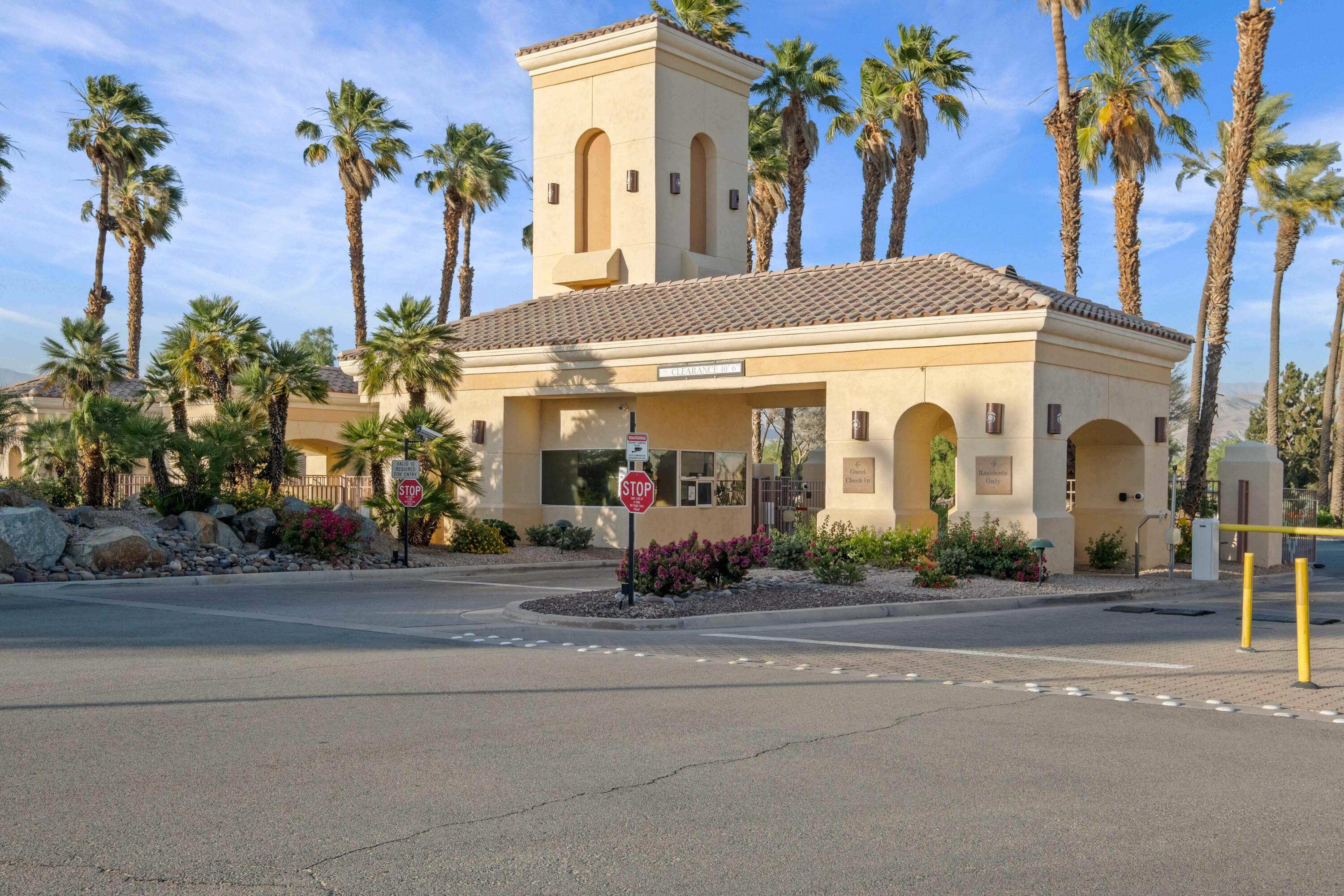78786 Silver Lake Terrace Palm Desert, CA 92211 - Photo 17 of 20 a view of a building with a cars park side of a road