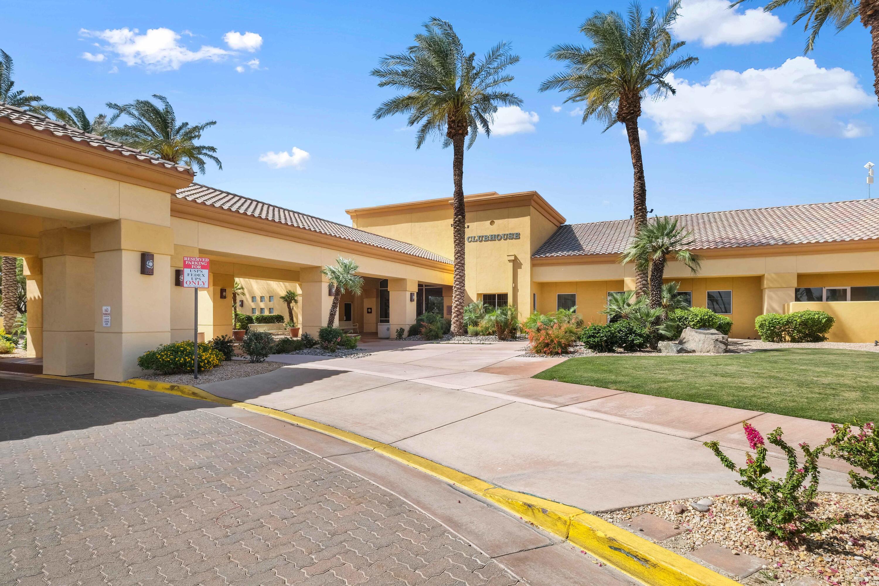 78786 Silver Lake Terrace Palm Desert, CA 92211 - Photo 18 of 20 a front view of house with yard and green space
