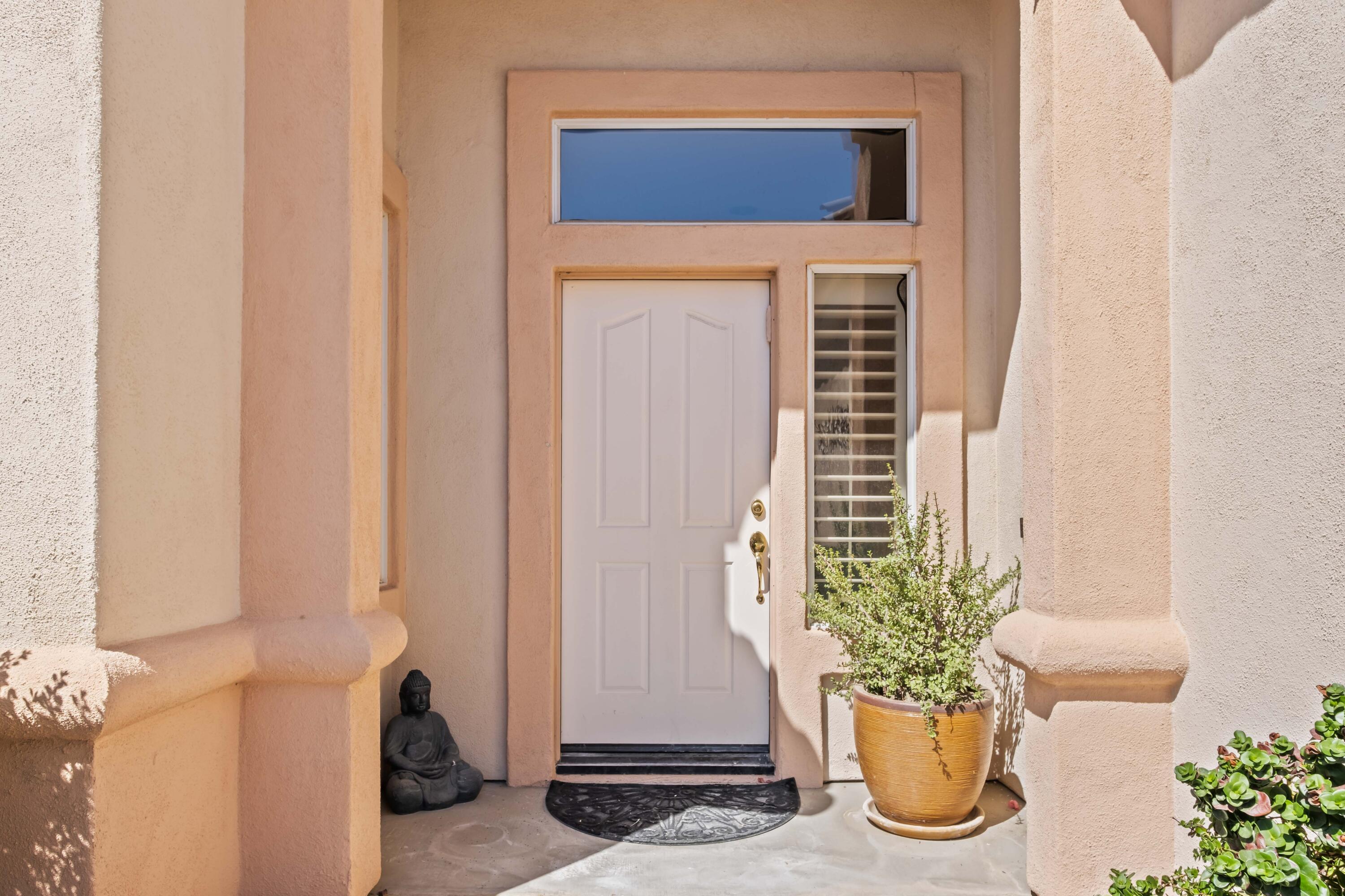 78786 Silver Lake Terrace Palm Desert, CA 92211 - Photo 3 of 20 a potted plant sitting in front of a door