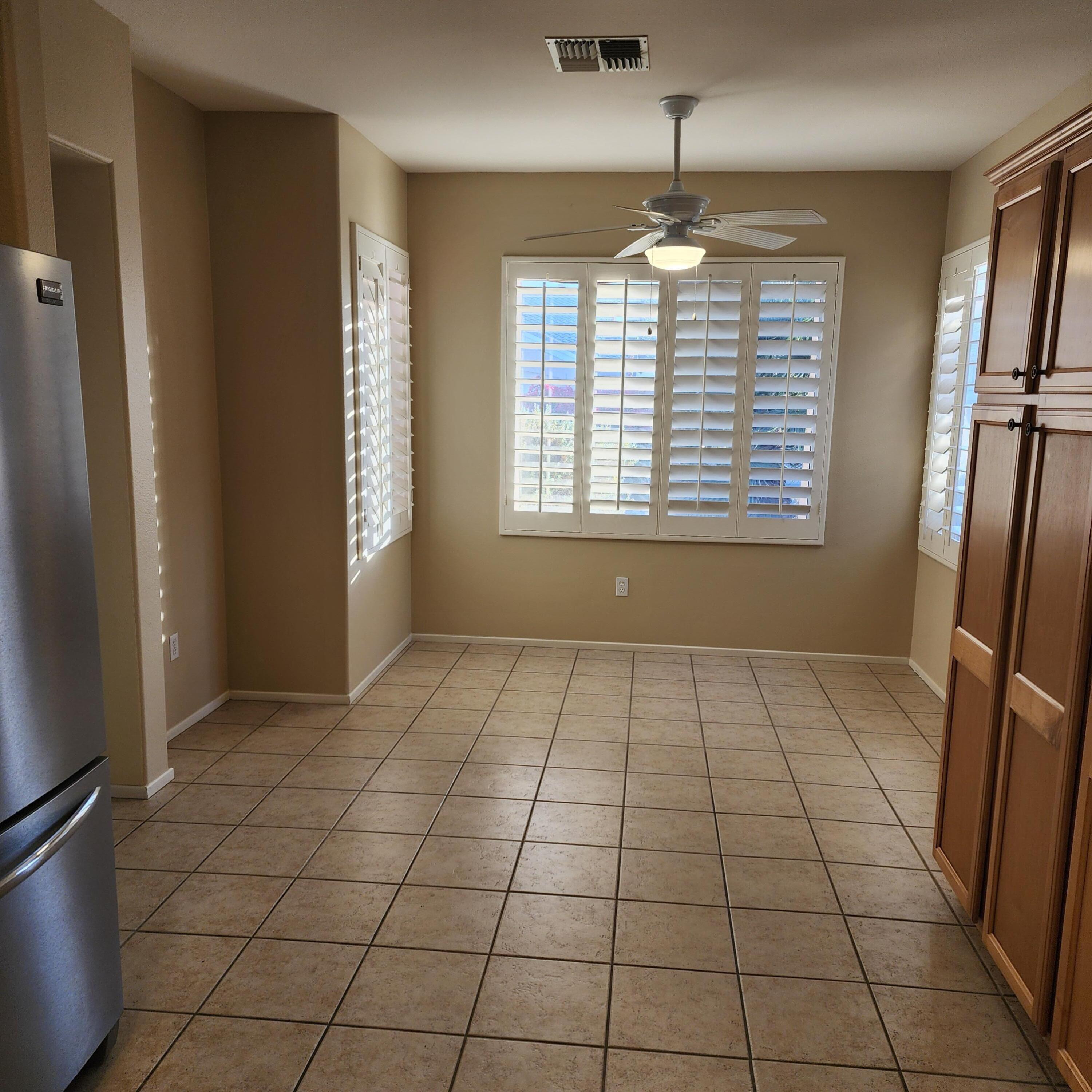 78786 Silver Lake Terrace Palm Desert, CA 92211 - Photo 8 of 20 a view of an empty room with a window