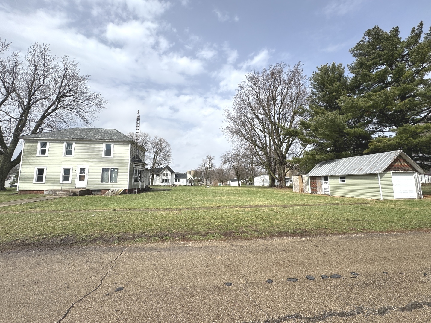 108 West 3rd Street Sublette, IL 61367 - Photo 3 of 4 a view of a big house with a big yard and large trees