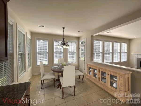 a living room with furniture and windows