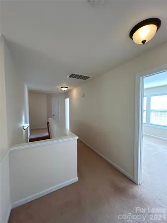 a view of a livingroom and a ceiling fan