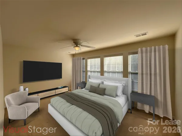a bedroom with a bed and a flat screen tv