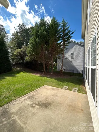 a view of backyard with green space