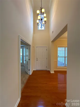 a view of an entryway with wooden floor
