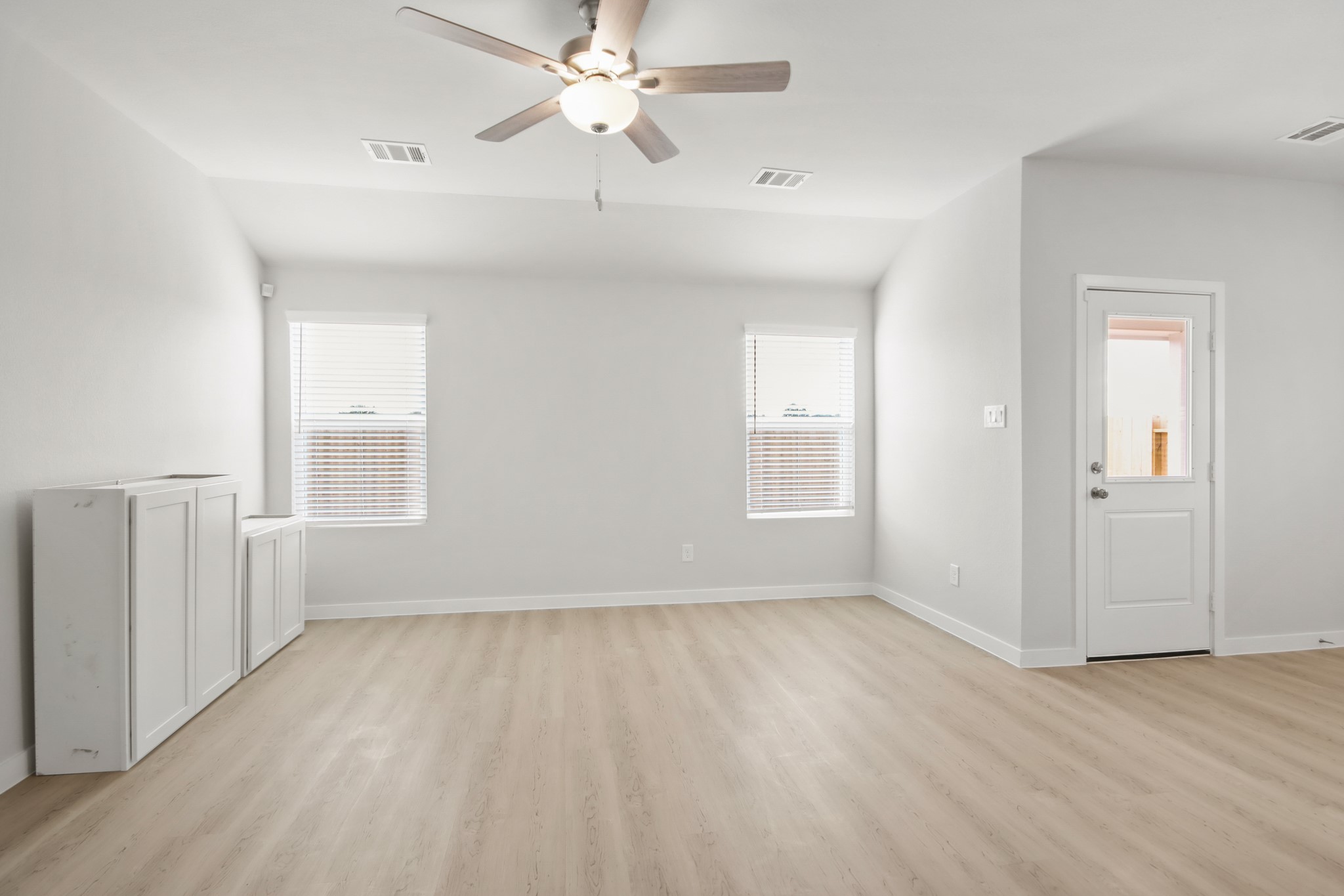 9715 Caney Bend Road Conroe, TX 77303 - Photo 6 of 24 wooden floor in an empty room with a window