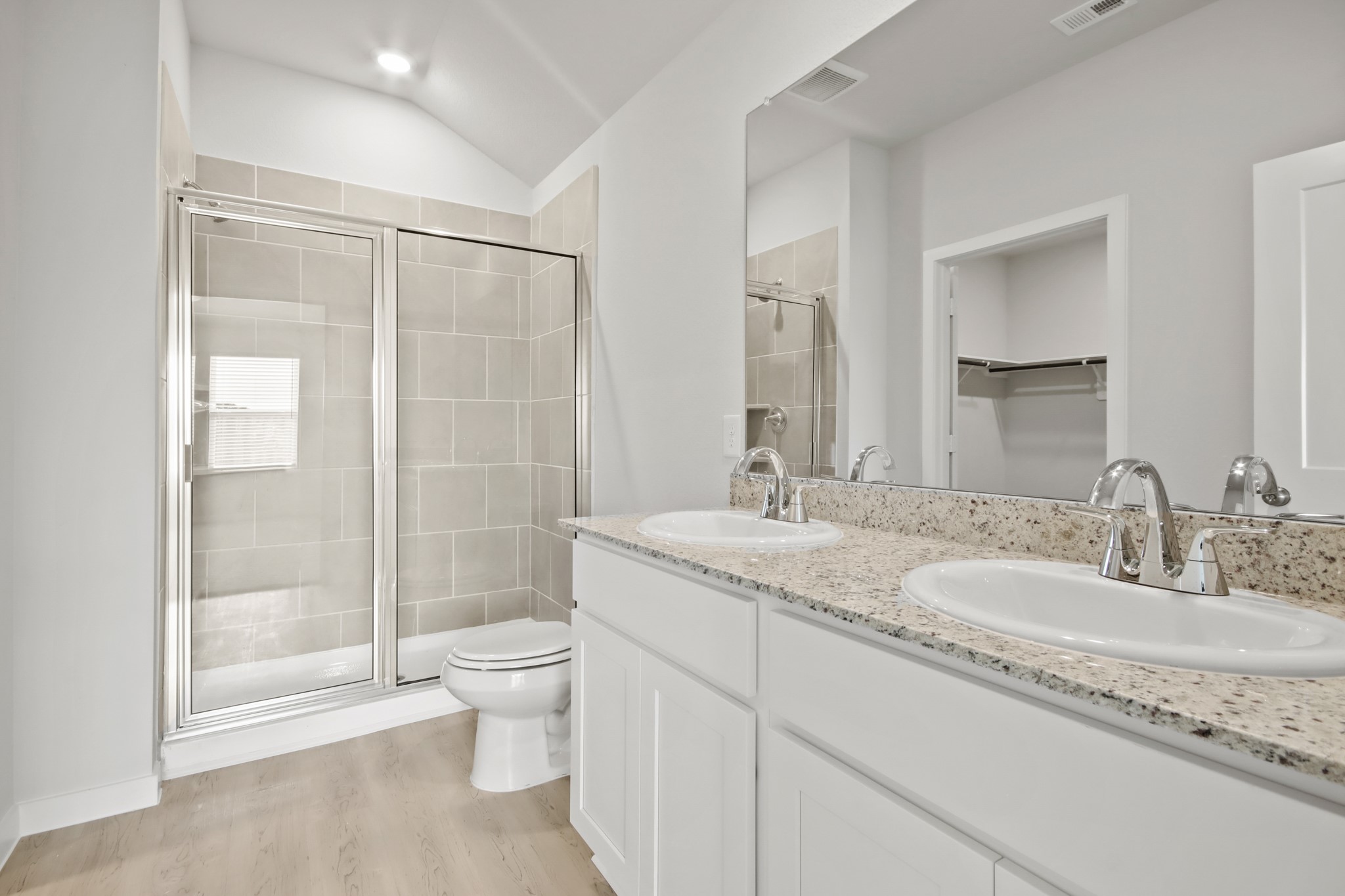 9715 Caney Bend Road Conroe, TX 77303 - Photo 10 of 24 a bathroom with a granite countertop sink a toilet and shower