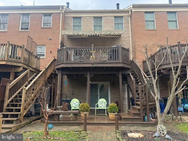 908 Walnut Wood Road Cockeysville, MD 21030 - Photo 3 of 5 a front view of a house with garden and porch