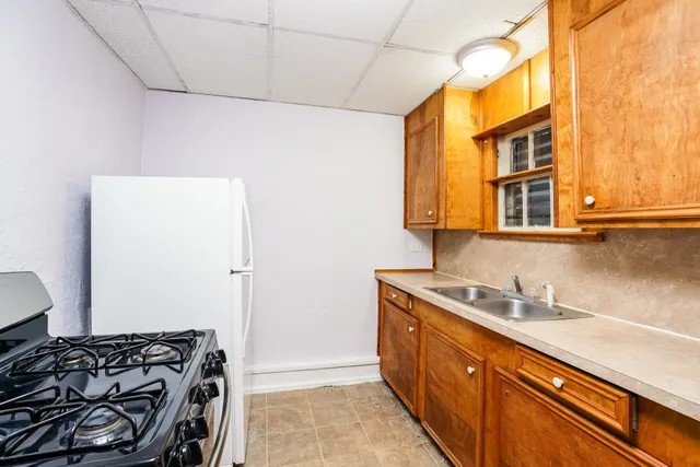 a kitchen with a stove and a sink