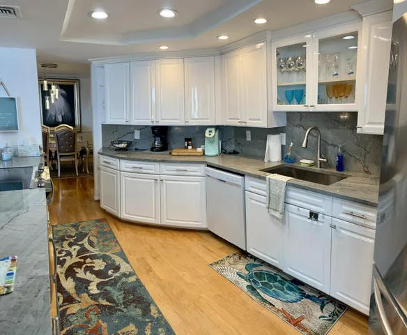 a view of a room with furniture and mirror