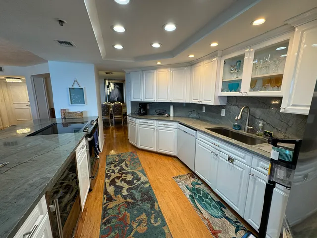 a living room with furniture a rug and a window