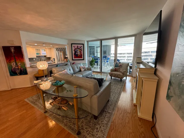 a bathroom with a sink a large mirror and vanity