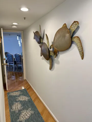 a living room with furniture and a mirror