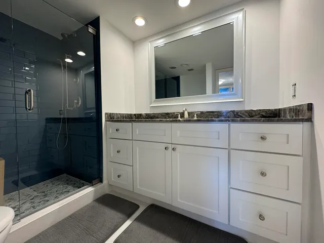 a view of a swimming pool and lounge chairs