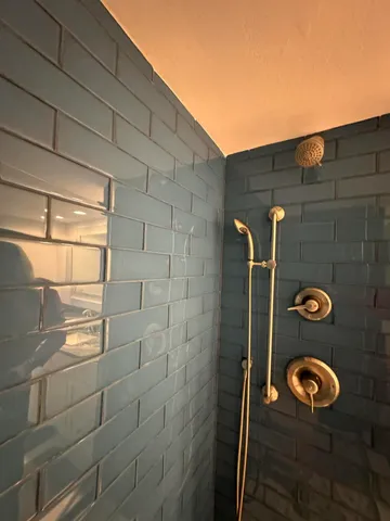 a kitchen with a stove and a white cabinets