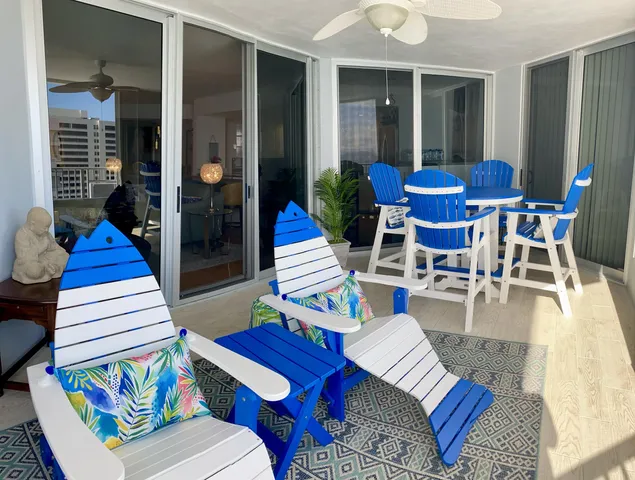 a view of balcony with furniture