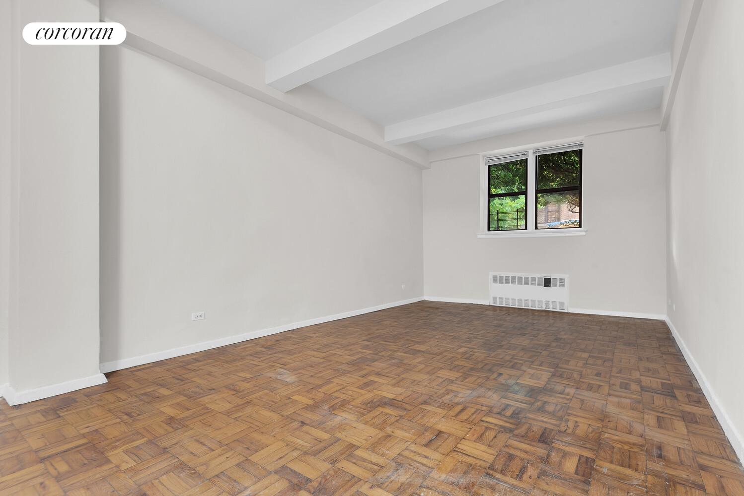 2830 Briggs Avenue, Unit WIA Bronx, NY 10458 - Photo 2 of 7 an empty room with a window