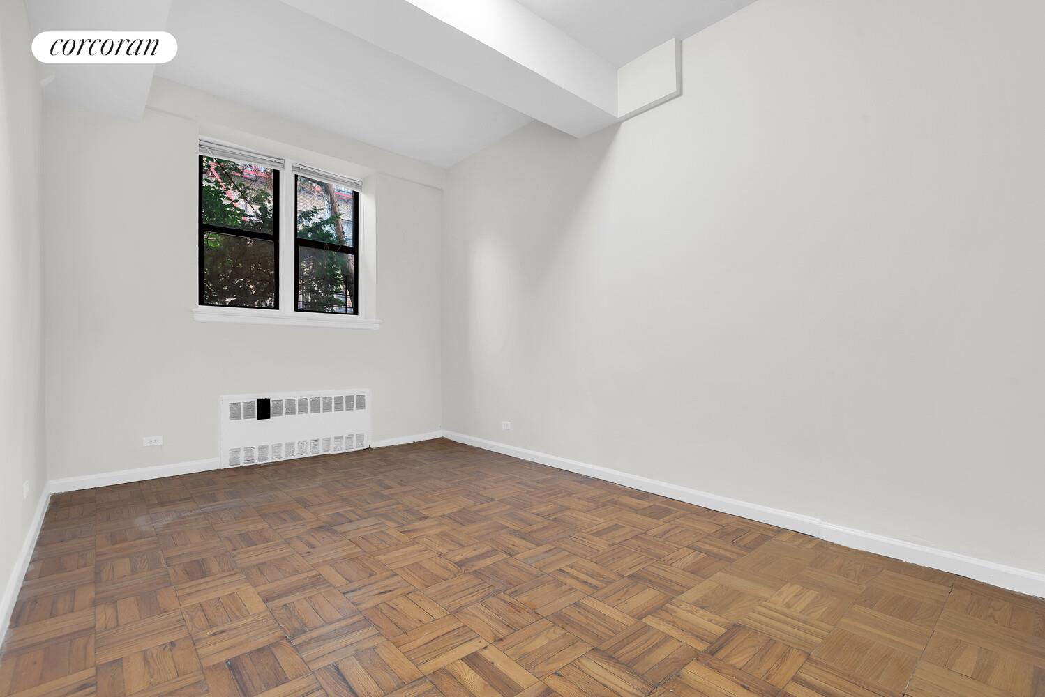 2830 Briggs Avenue, Unit WIA Bronx, NY 10458 - Photo 4 of 7 a view of an empty room with a window