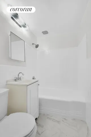 a kitchen with granite countertop cabinets and white appliances