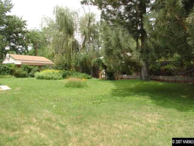 925 Whitaker Drive Reno, NV 89503 - Photo 7 of 9 a view of a garden with a bench