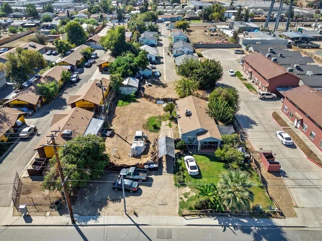 an aerial view of residential houses with outdoor space