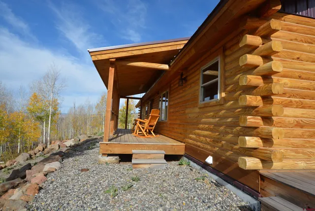 a backyard of a house with wooden stairs