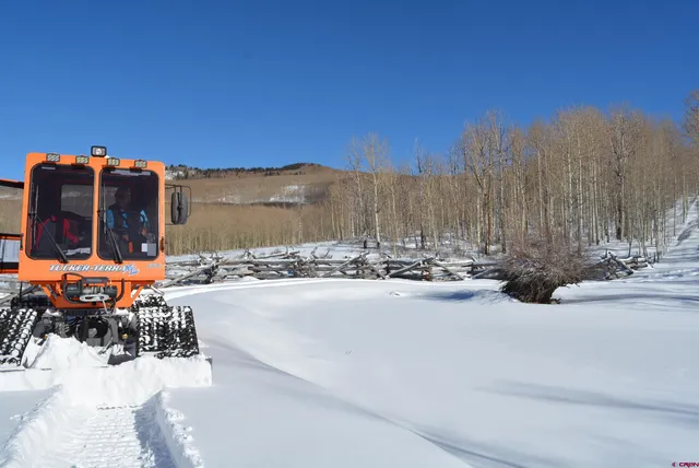 a view of balcony with floor and wooden fence