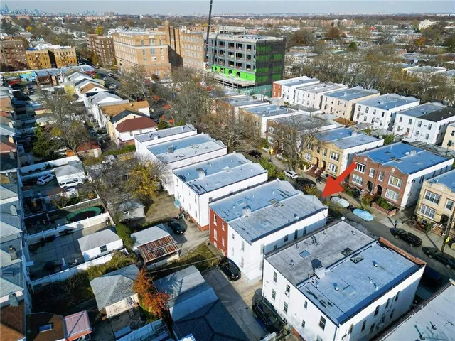 an aerial view of a house with a city view