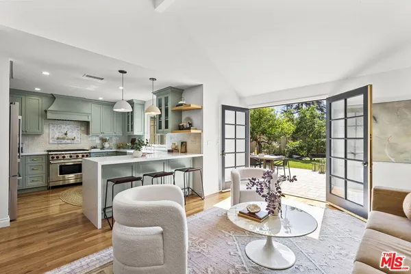 a kitchen with a table and chairs