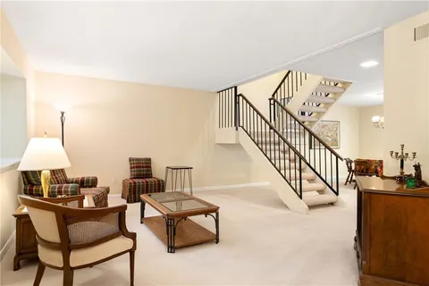 a living room with furniture and a table