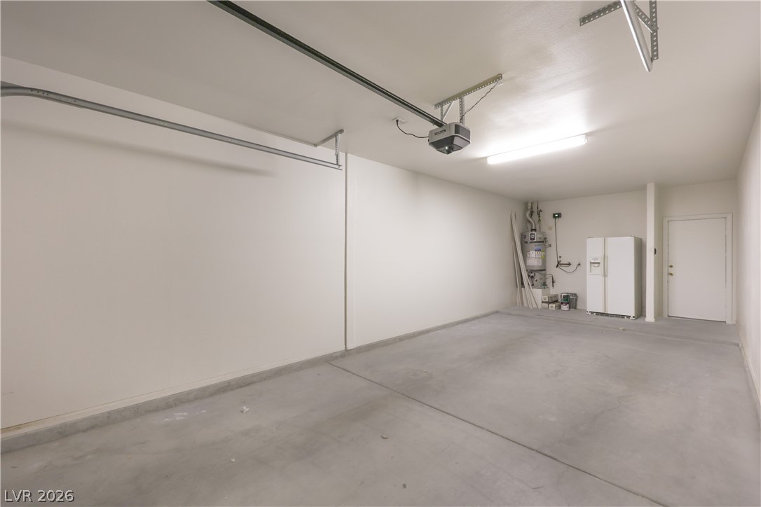 2050 West Warm Springs Road, Unit 1421 Henderson, NV 89014 - Photo 35 of 45 A spacious and pristine garage, ready for vehicles and additional storage.