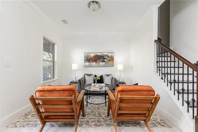 a living room with furniture a ceiling fan and a window