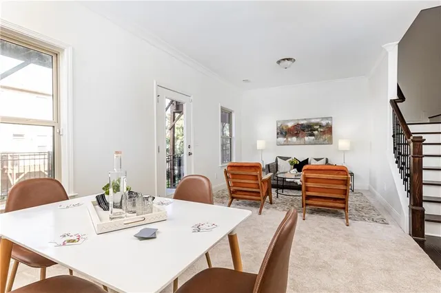 a dining room with furniture and wooden floor