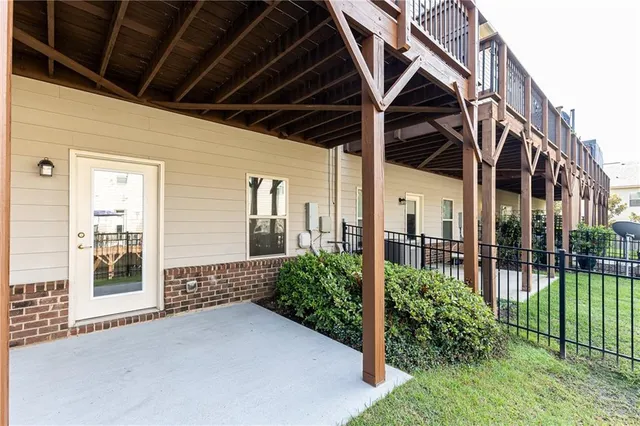 a view of a house with a small yard and plants